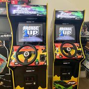 two arcade1up machines standing next to each other